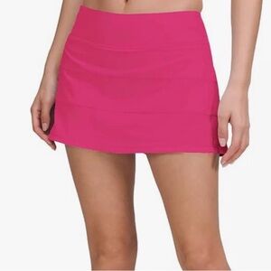 Hot pink tennis skirt.
